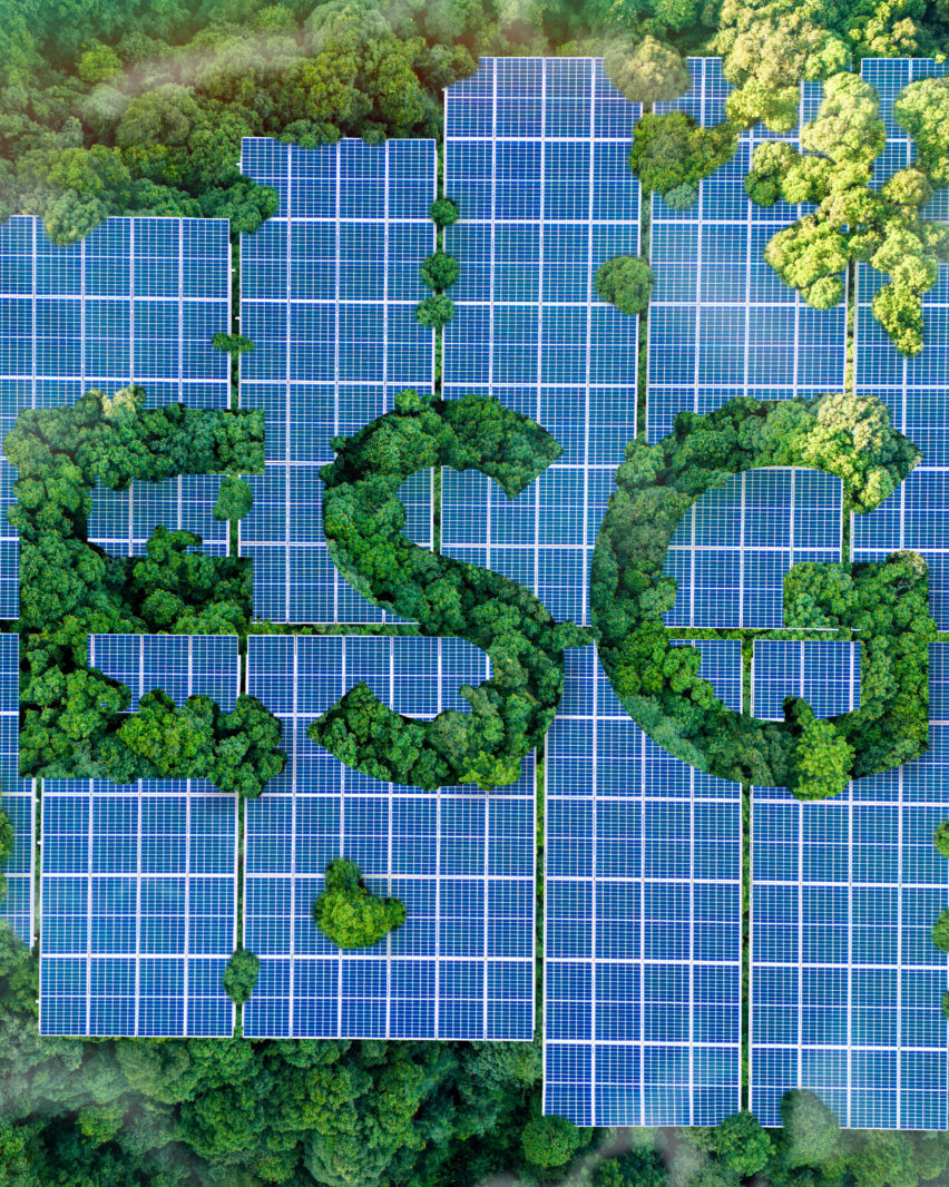 ESG concept for environmental, social, and governance sustainable business. the word ESG is on a solar panel installed in a lush forest. Sustainable organizational development. environmentally friendly energy